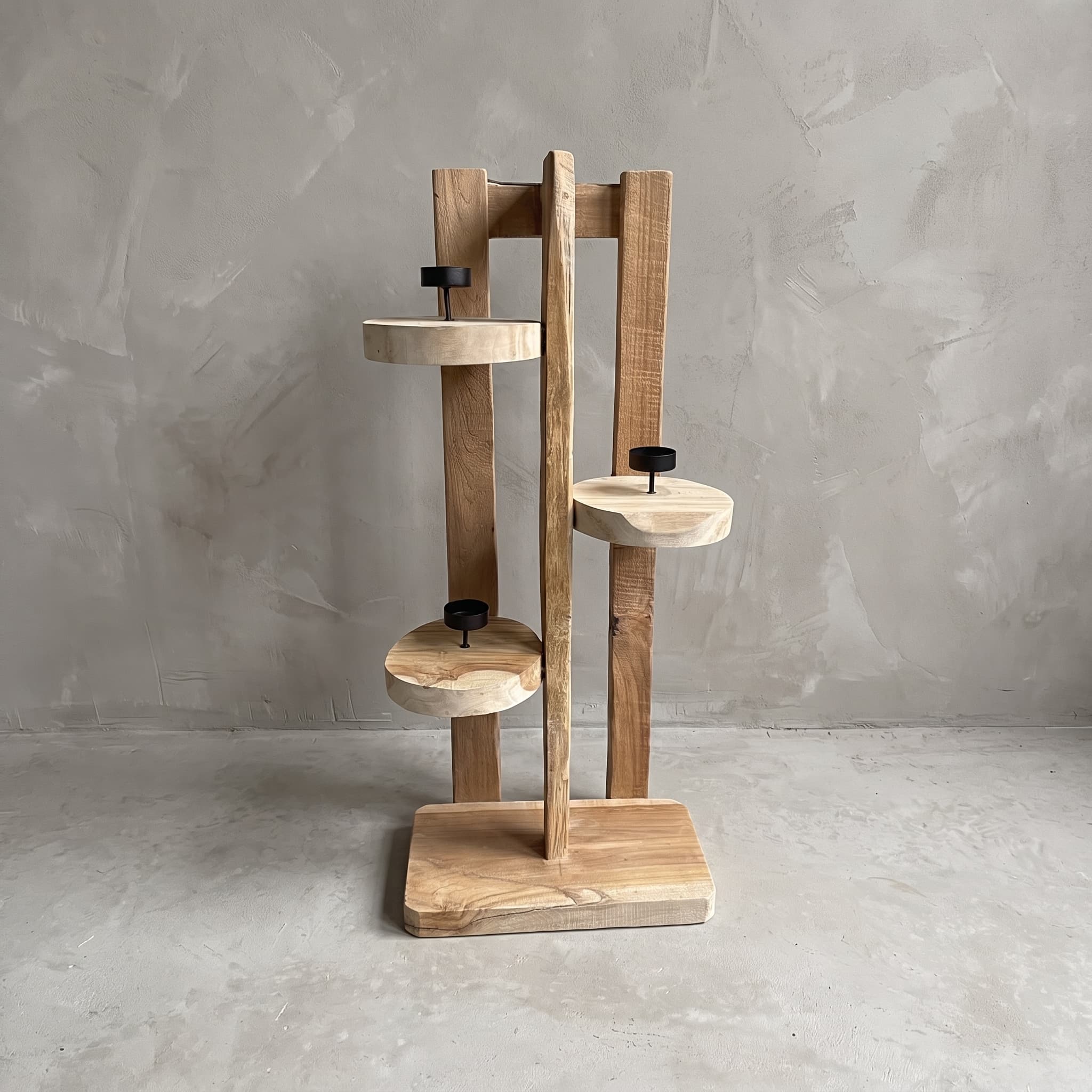Tumpuk reclaimed teak candle holder, front view with three round discs and black holders at different heights